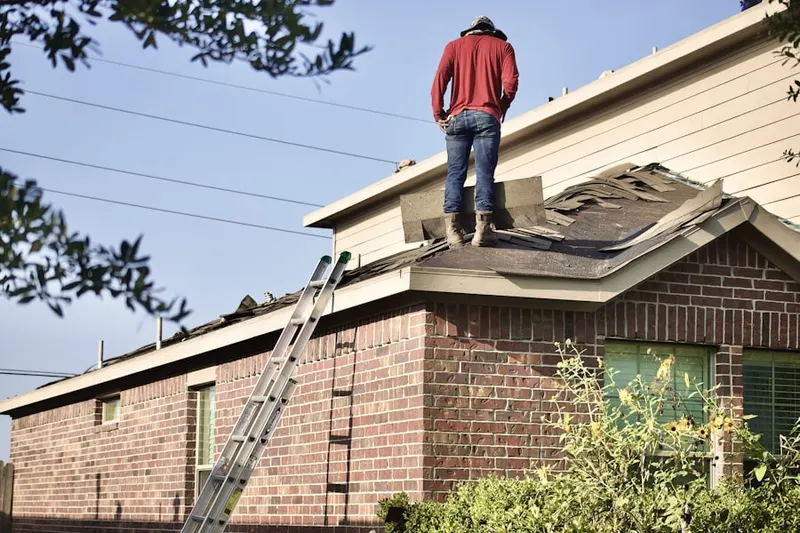 Professional roofer working on a residential roof in Seguin